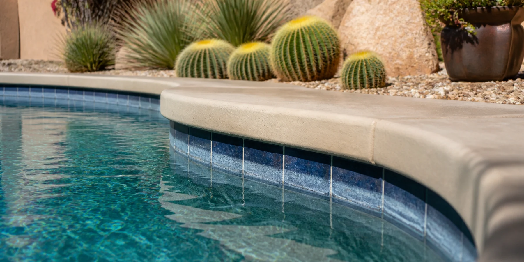 Arizona pool edge showing the effects of hard water, evaporation, and mineral buildup.